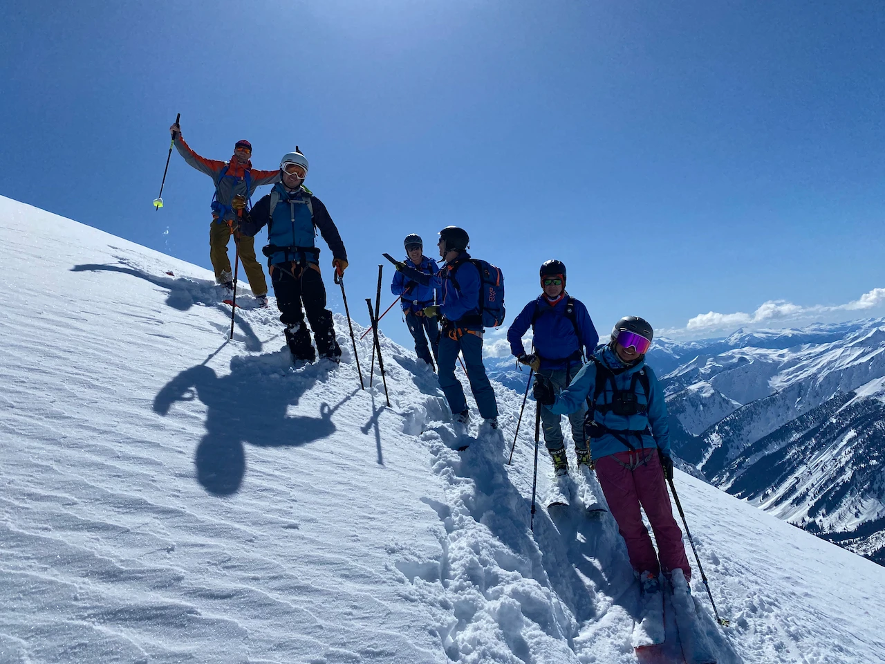 Skiers on the summit of a 3000m+ mountian