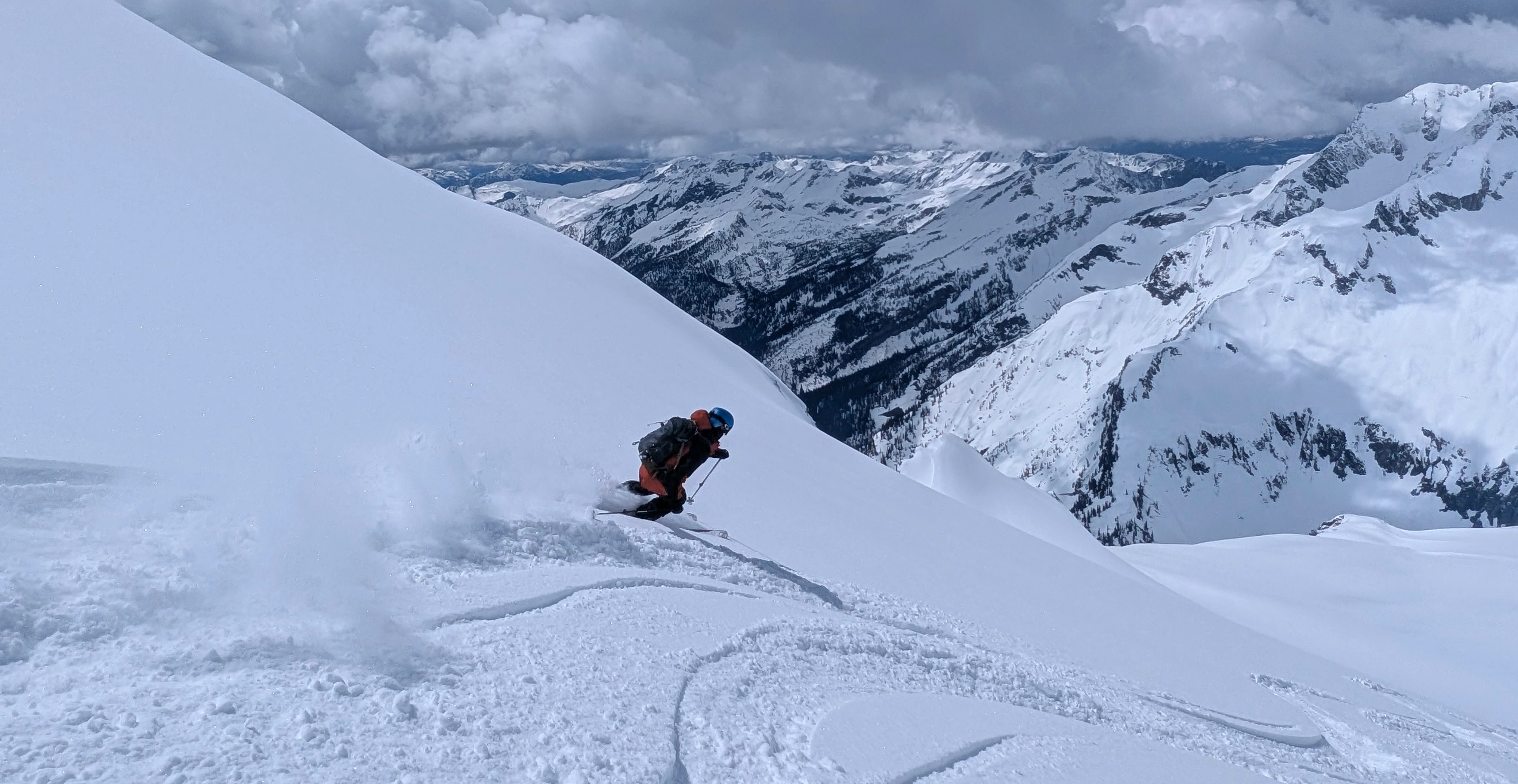 Backcountry Skier High in the Selkirk Mountains of B.C. Canada