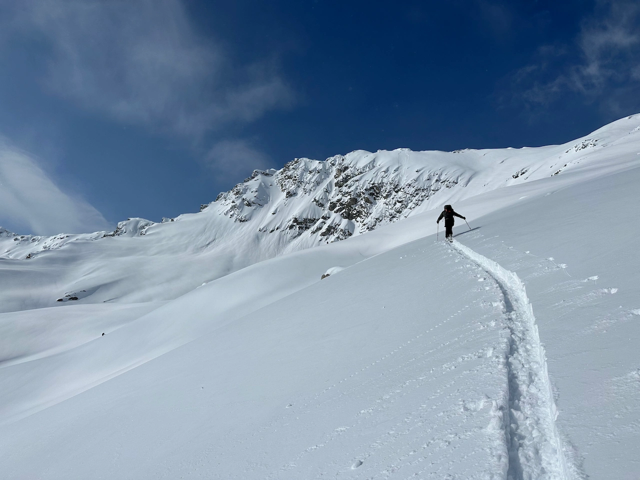 A guide braking trail fair ahead in a mountain vista