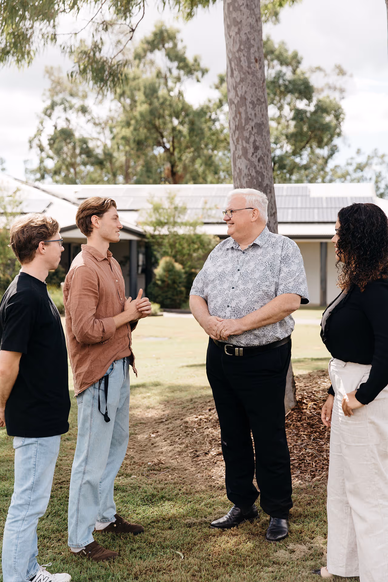 Prospective students speaking to a lecturer.