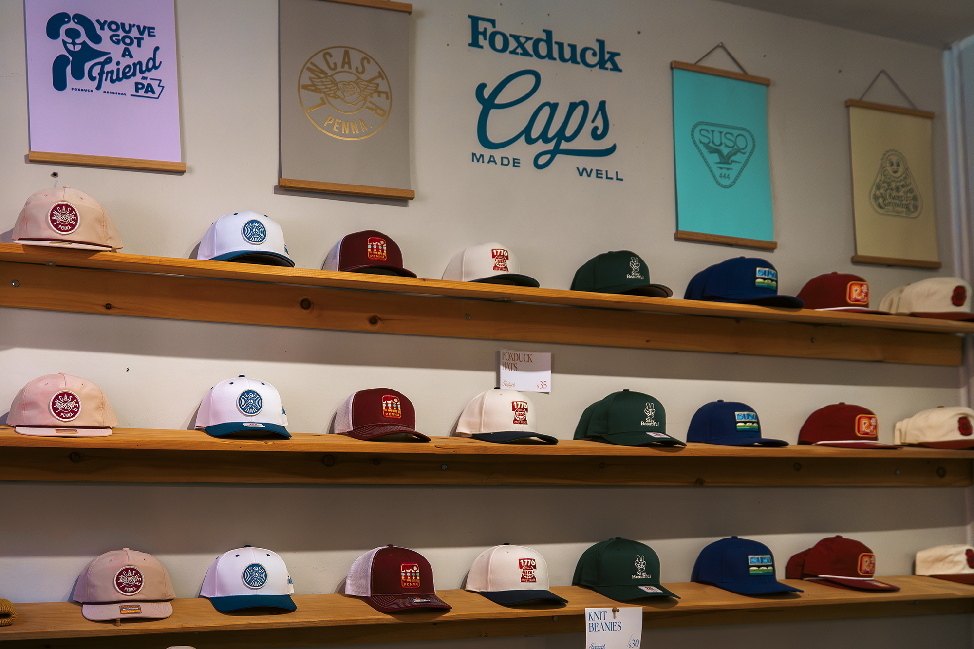 Shelves holding caps designed by Foxduck.