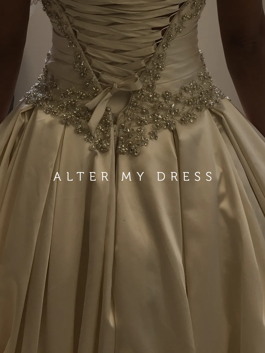 back view of Alter My Dress Philly bride in her wedding dress alterations