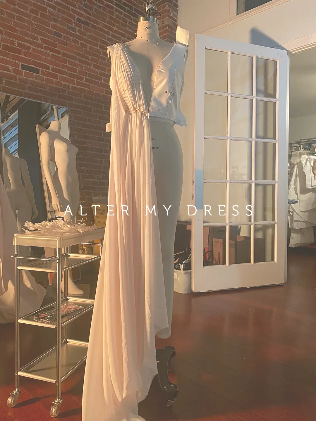 wedding dress on a form at Alter My Dress in Philadelphia studio