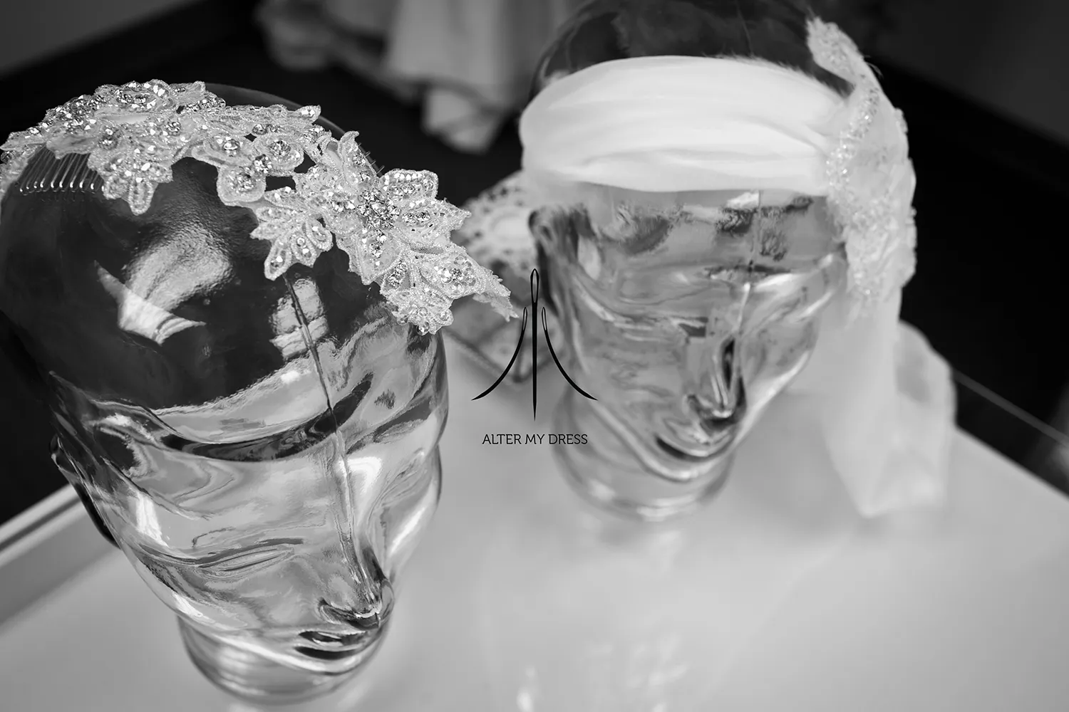Alter My Dress logo on black and white background image of wedding dress headpieces alterations