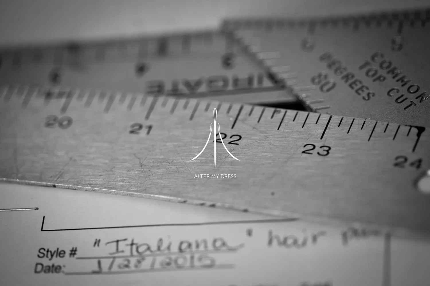 Alter My Dress logo on black and white background image of wedding dress alterations tape measure and client order from 2015