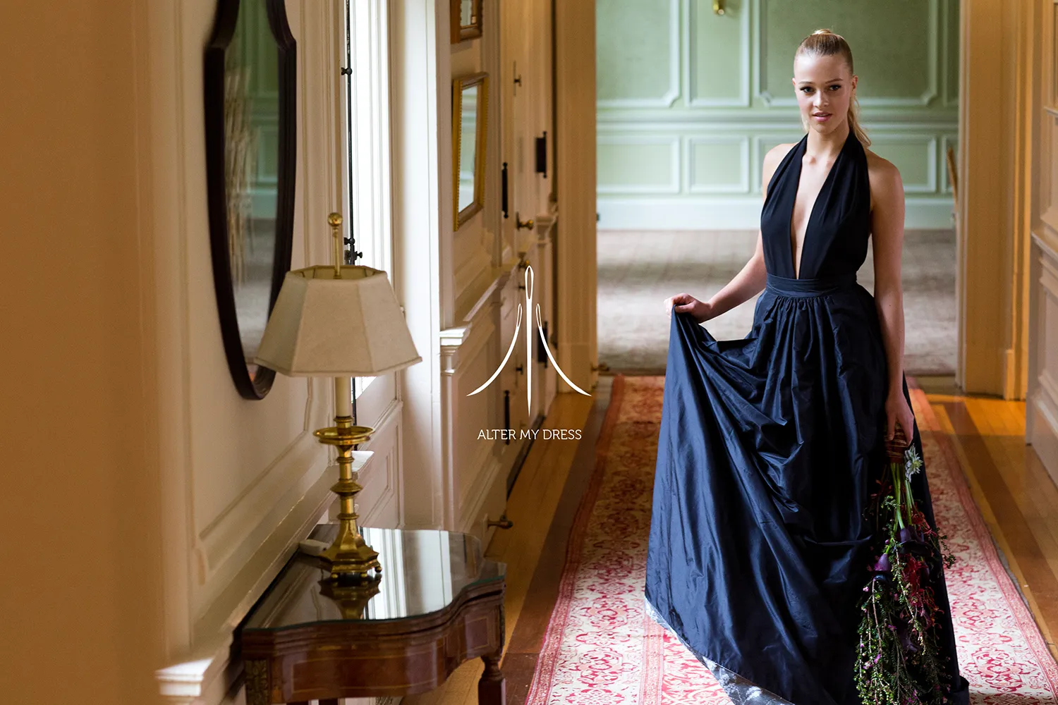 Alter My Dress logo on image of a bride in her dark wedding gown