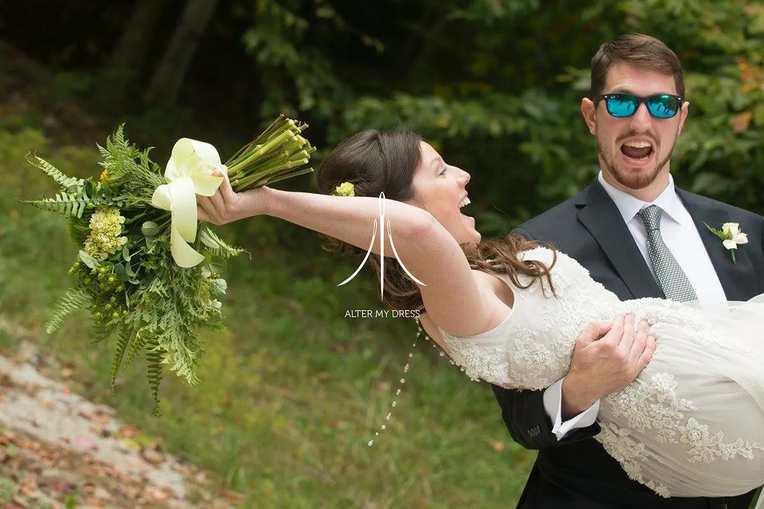 Flowing dress with a gradient from red to purple on a wheeled dress form in a room with peeling paint on the walls.