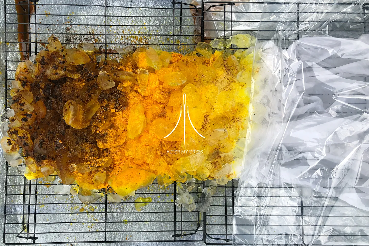 Fashion designer adjusting a sheer, beaded top and white tulle skirt worn by a model against a white background with Alter My Dress logo.