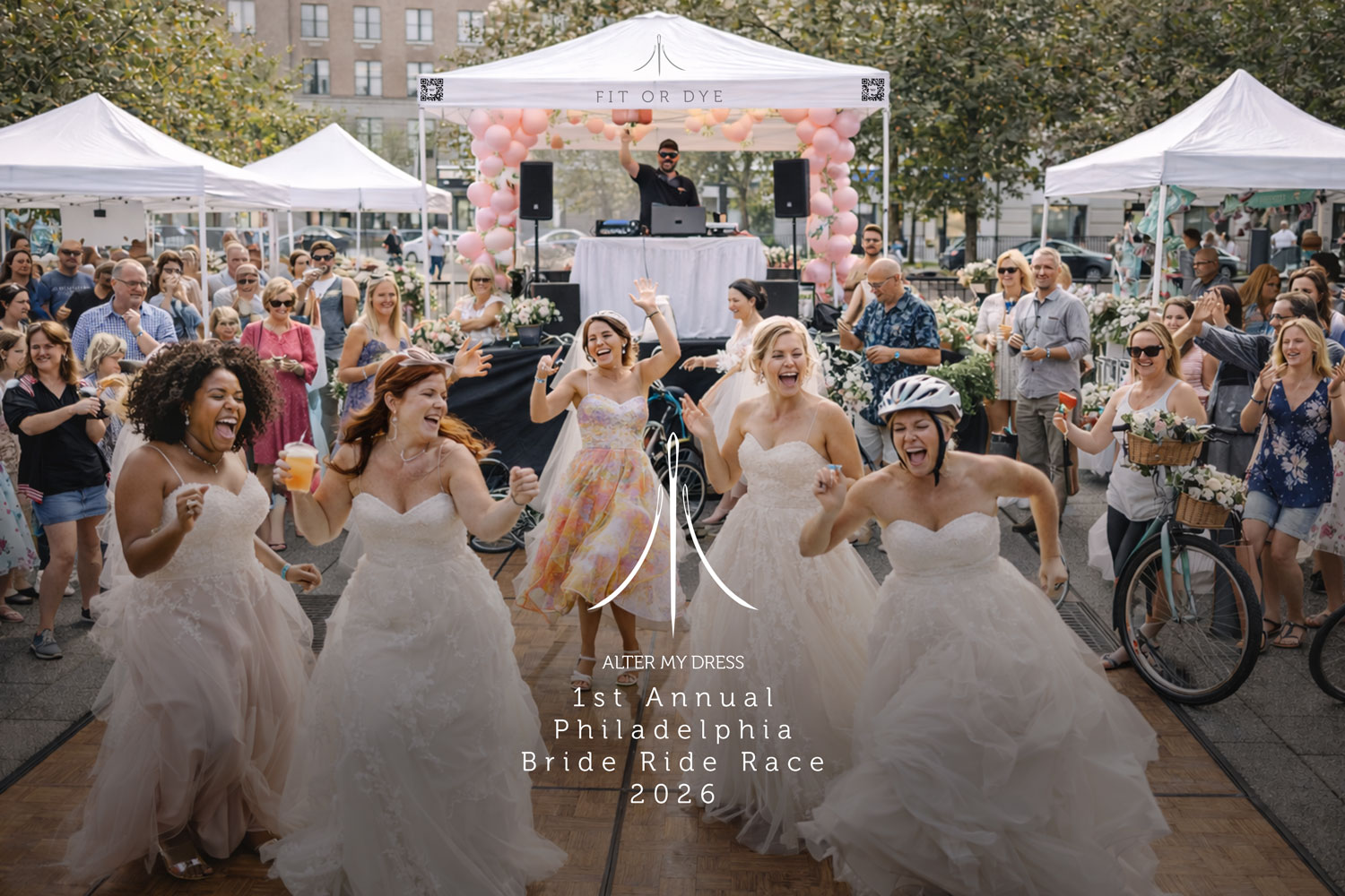 Several brides in wedding dresses joyfully dancing and racing with a crowd watching and a DJ under a tent decorated with pink balloons.
