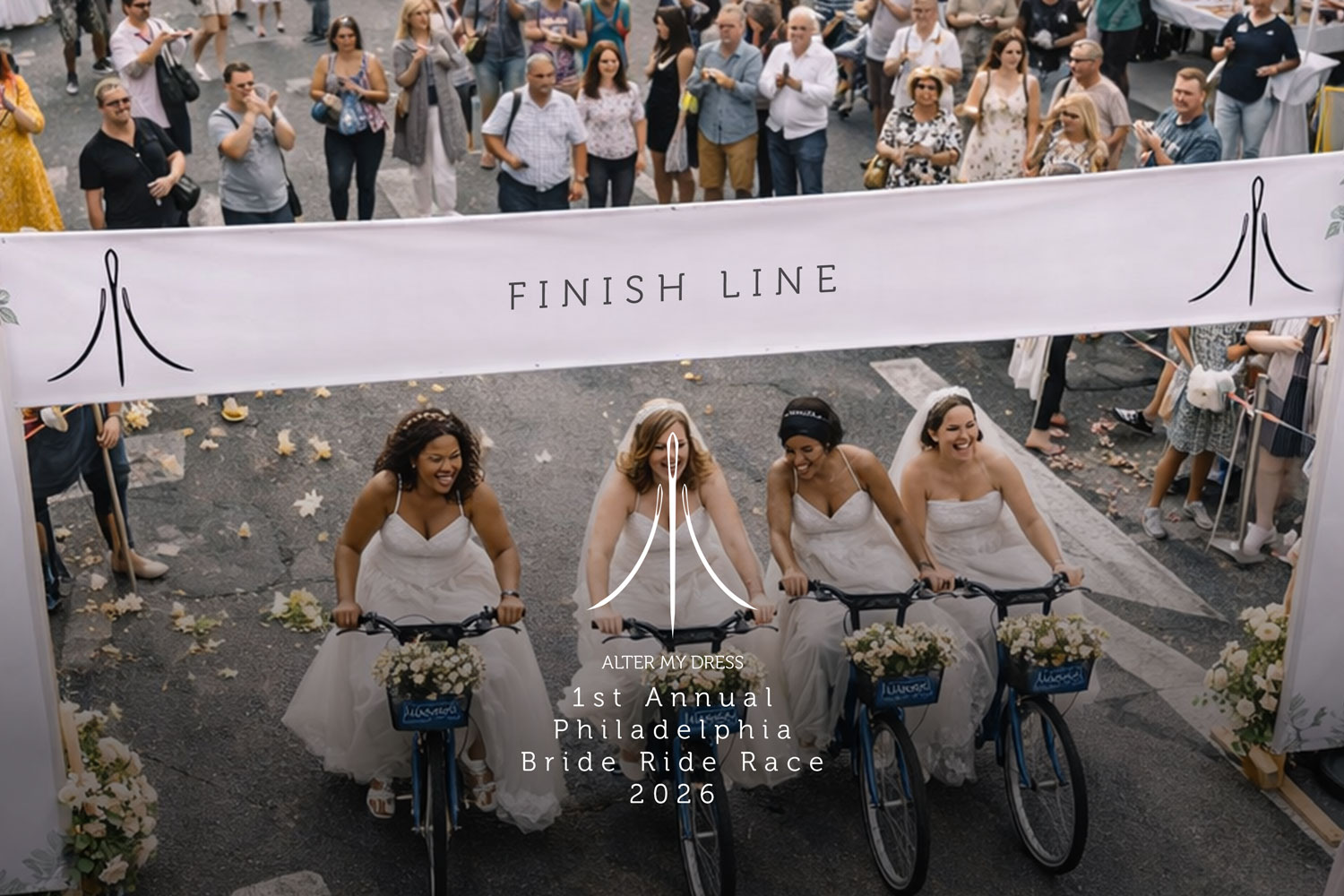 Four brides in wedding dresses riding decorated bicycles crossing a finish line during the 1st Annual Philadelphia Bride Ride Race 2026 with spectators clapping.