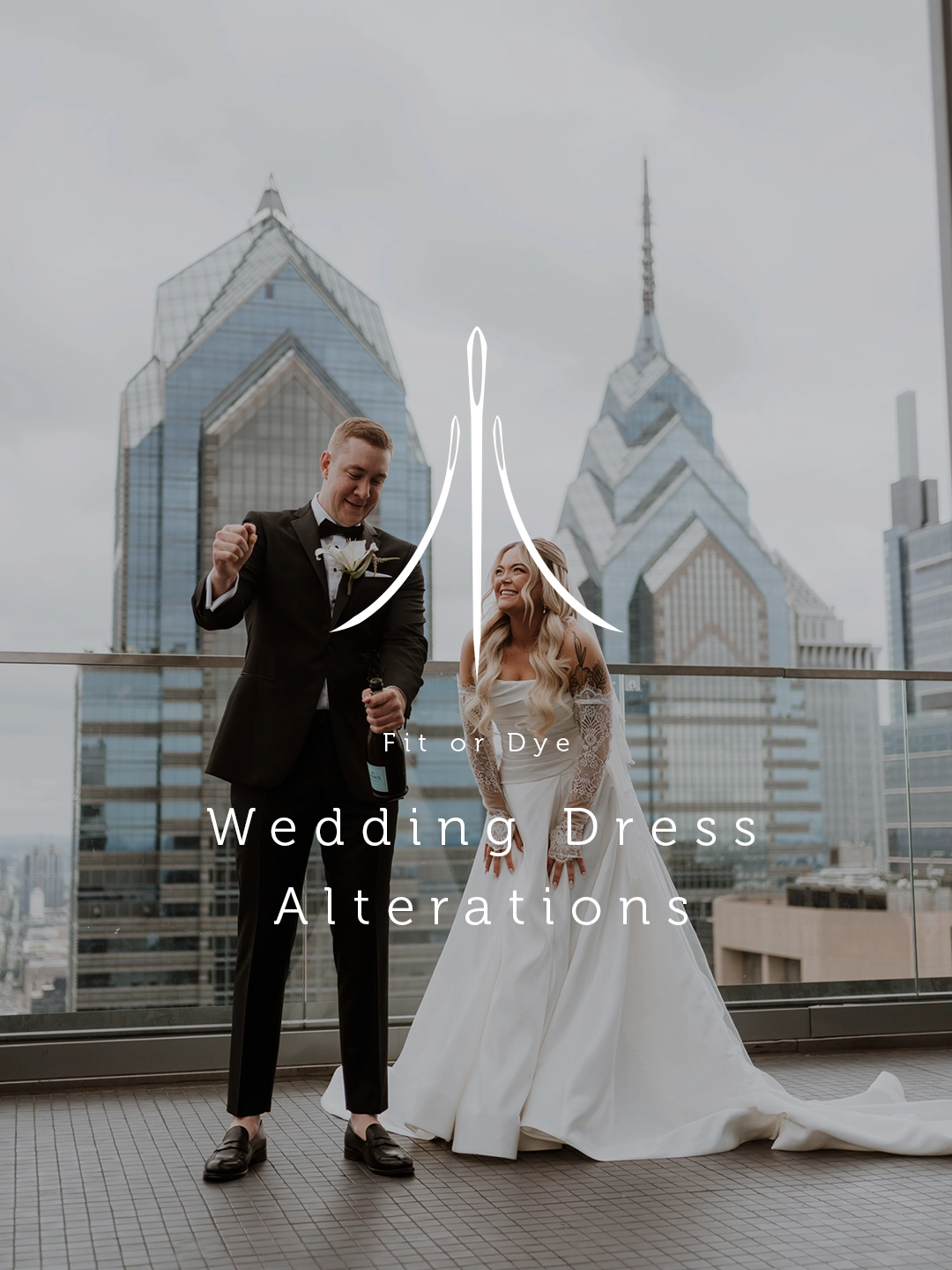 Bride and groom standing outdoors on a balcony overlooking Philadelphia skyline. Logo and overlay title Wedding Dress Alterations