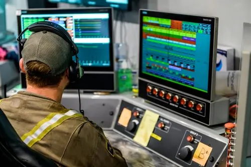 Am image of an EQT tech working on a computer