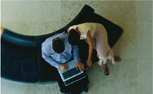 Corebridge life insurance awareness image of agent and client looking at laptop