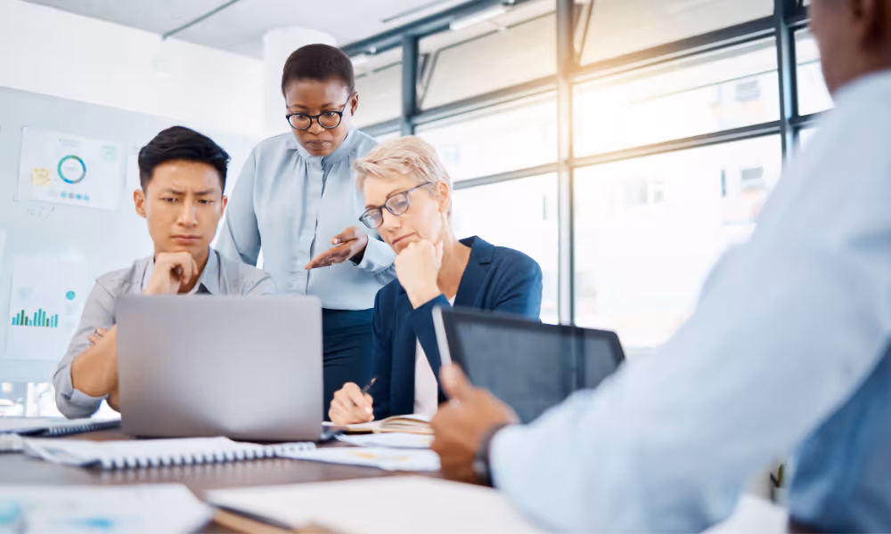 Employees gathered around table.
