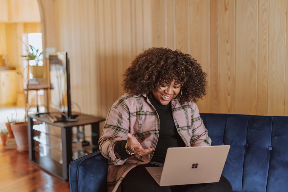 woman smiling at computer