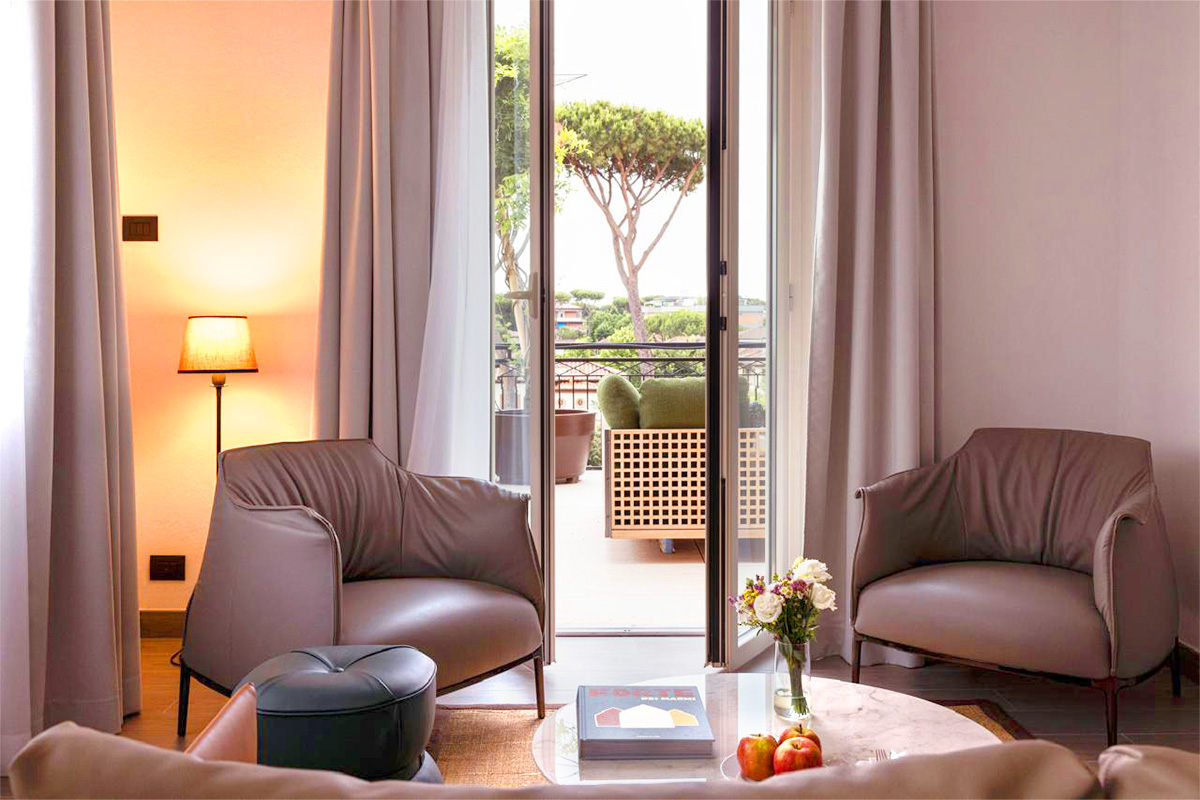 Elegant hotel room featuring a double bed, soft lighting, and a cozy ambiance.