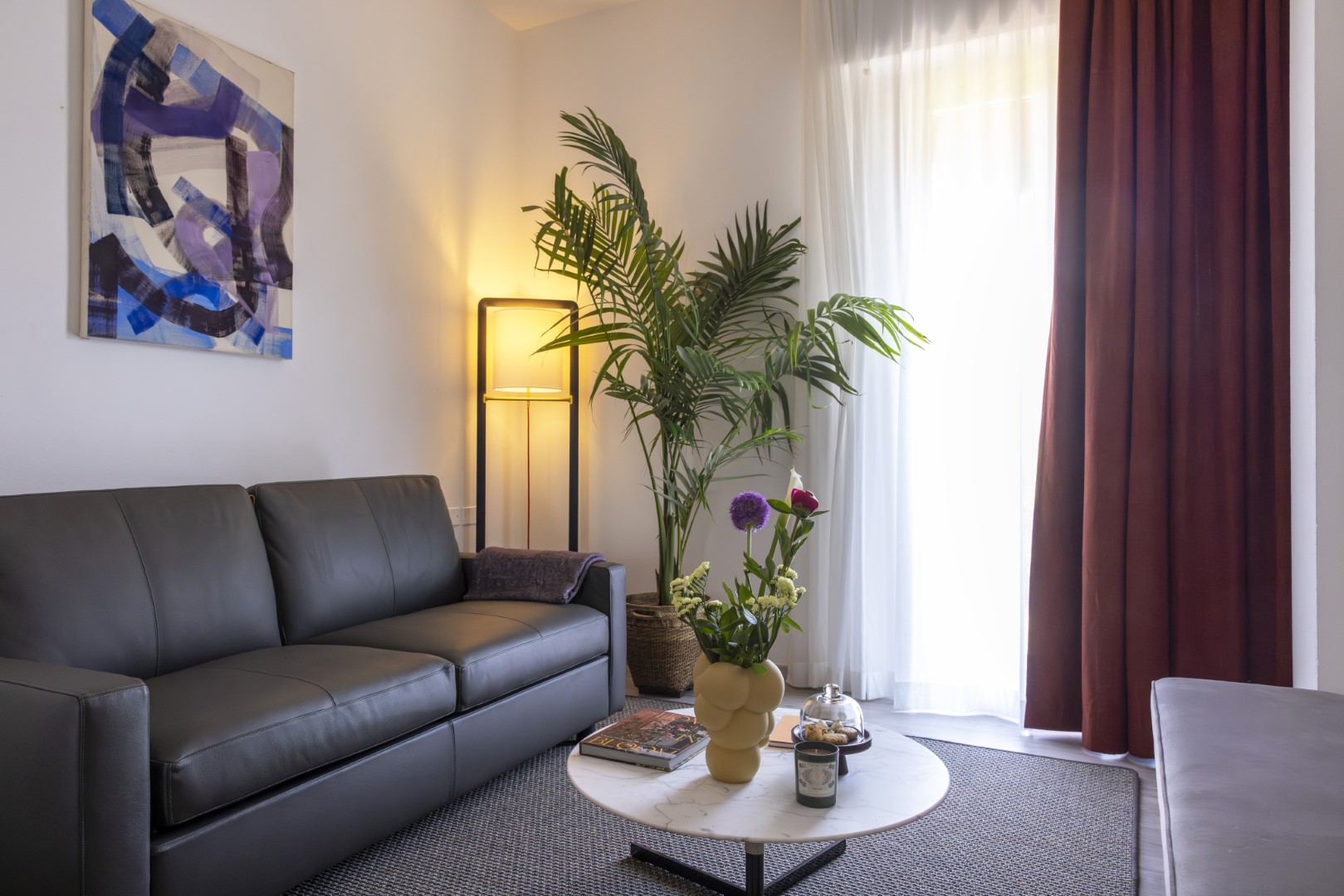 Room featuring soft lighting and luxurious bedding for ultimate comfort.