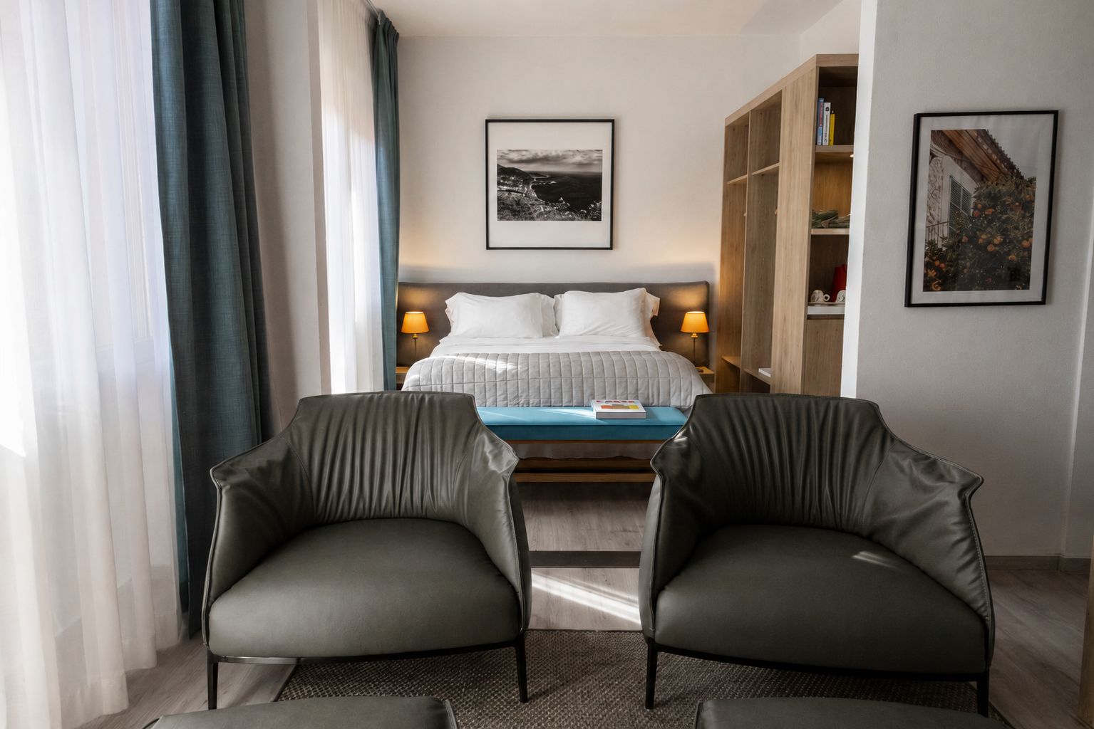 Private balcony of a Junior Suite with cozy seating and a stunning view.