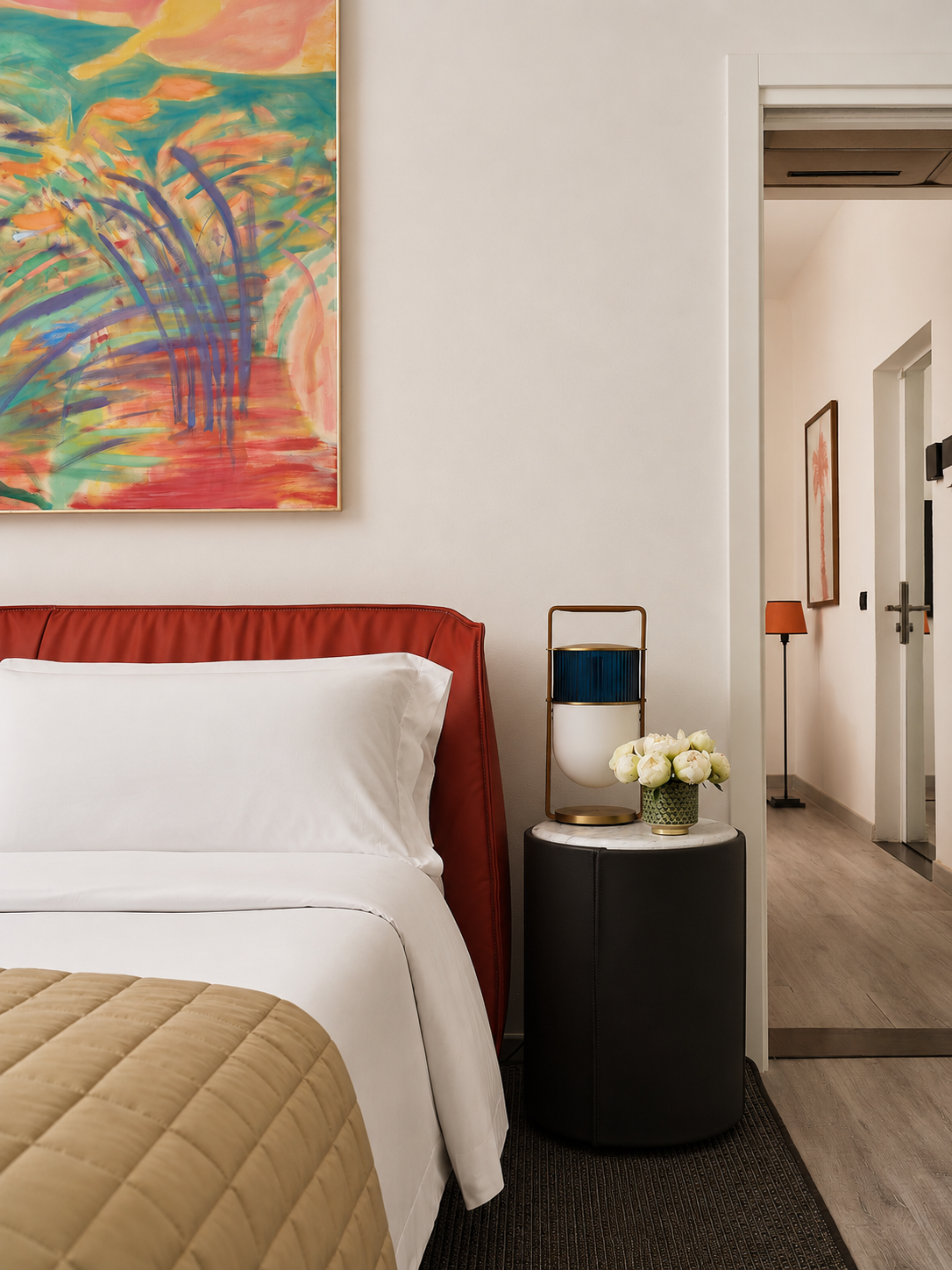 Hotel balcony attached to a family room, overlooking lush gardens and the pool.