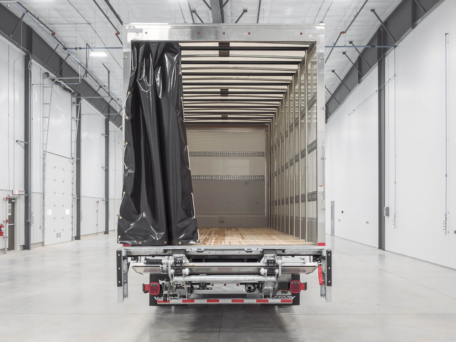 Close-up of stainless-steel rear frame and rear sill on a Victory demountable truck body