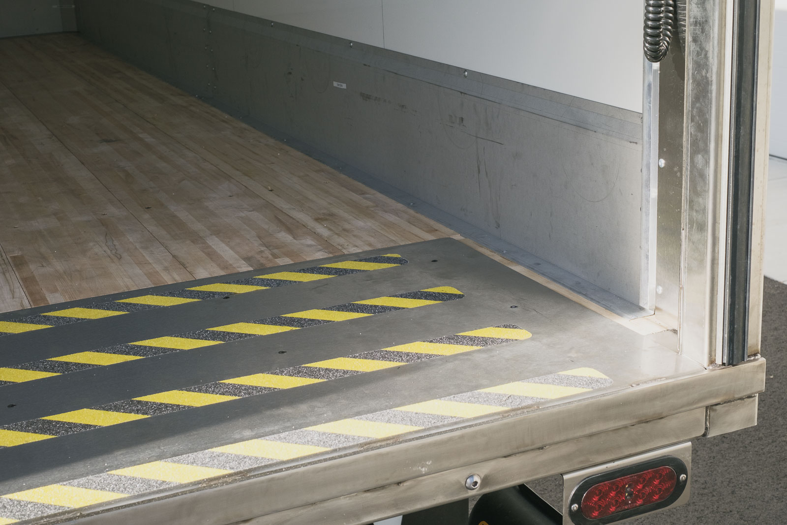 We eliminated the drain trough in the stainless rear frame and added a smooth aluminum threshold plate.