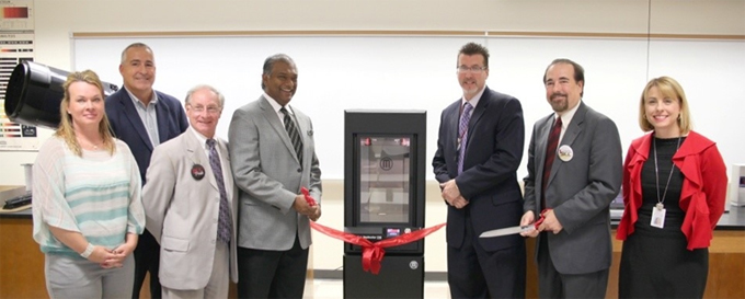 A group photo of seven individuals standing together. From left to right: Danilyn Thevanayagam, Burlington County Freeholder Director Bruce Garganio, BCC Foundation Board Vice-Chair Barry Lefkowitz, Parts Life, Inc. CEO Sam Thevanayagam, BCC Interim President Dr. David Spang, BCC Physics Lecturer Greg Perugini, and BCC Vice President of Institutional Advancement/Executive Director of the BCC Foundation Rebecca Corbin. Photo by Traci Soto.