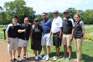Members of the Parts Life, Inc. team at the NDIA golf outing event, posing together. From left to right: Andrew Stewart, Rick Paciti, Sheila Harris-Adams, Paul Scrimale, Sam Thevanayagam, Chris Small, and Jeannie Whitfield.