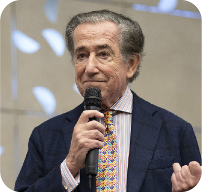 A diverse group of musicians and singers performing on a stage, with a woman singing into a microphone and a guitarist playing beside her.