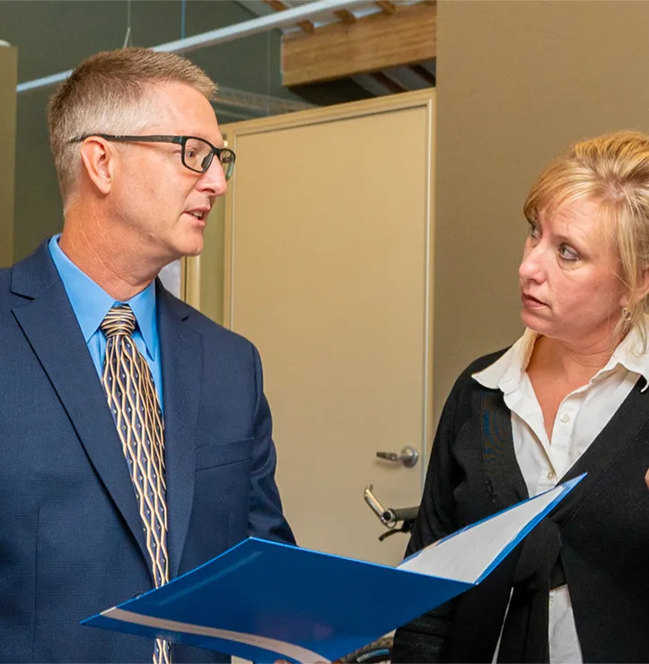 Mike Mullens, regional manager in Ironpeak Southwest visits with a Member Agent.