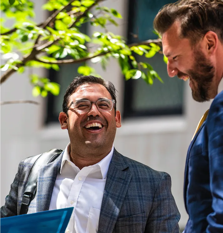 Christian Rebello, an Ironpeak regional manager, shares a joke with a client.
