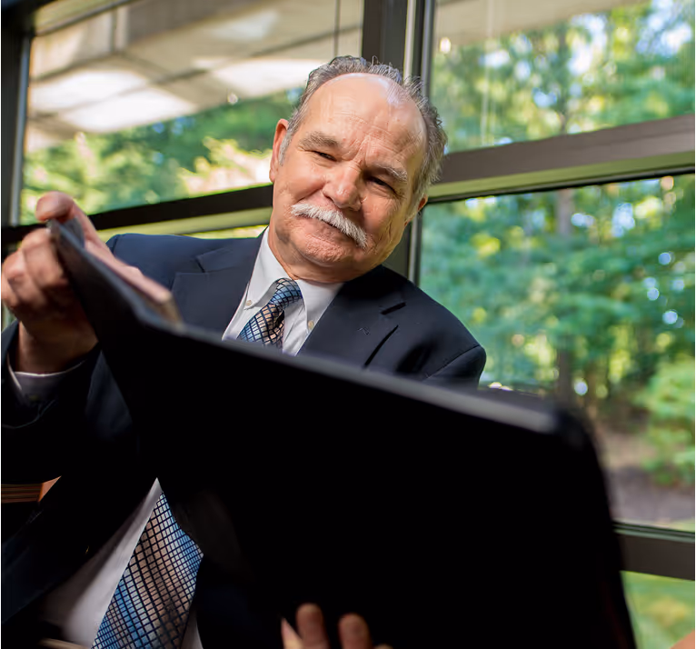 An Ironpeak regional manager reviews the profit sharing reports for a Member Agency. 