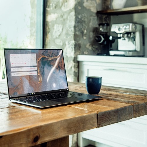 laptop on wooden table