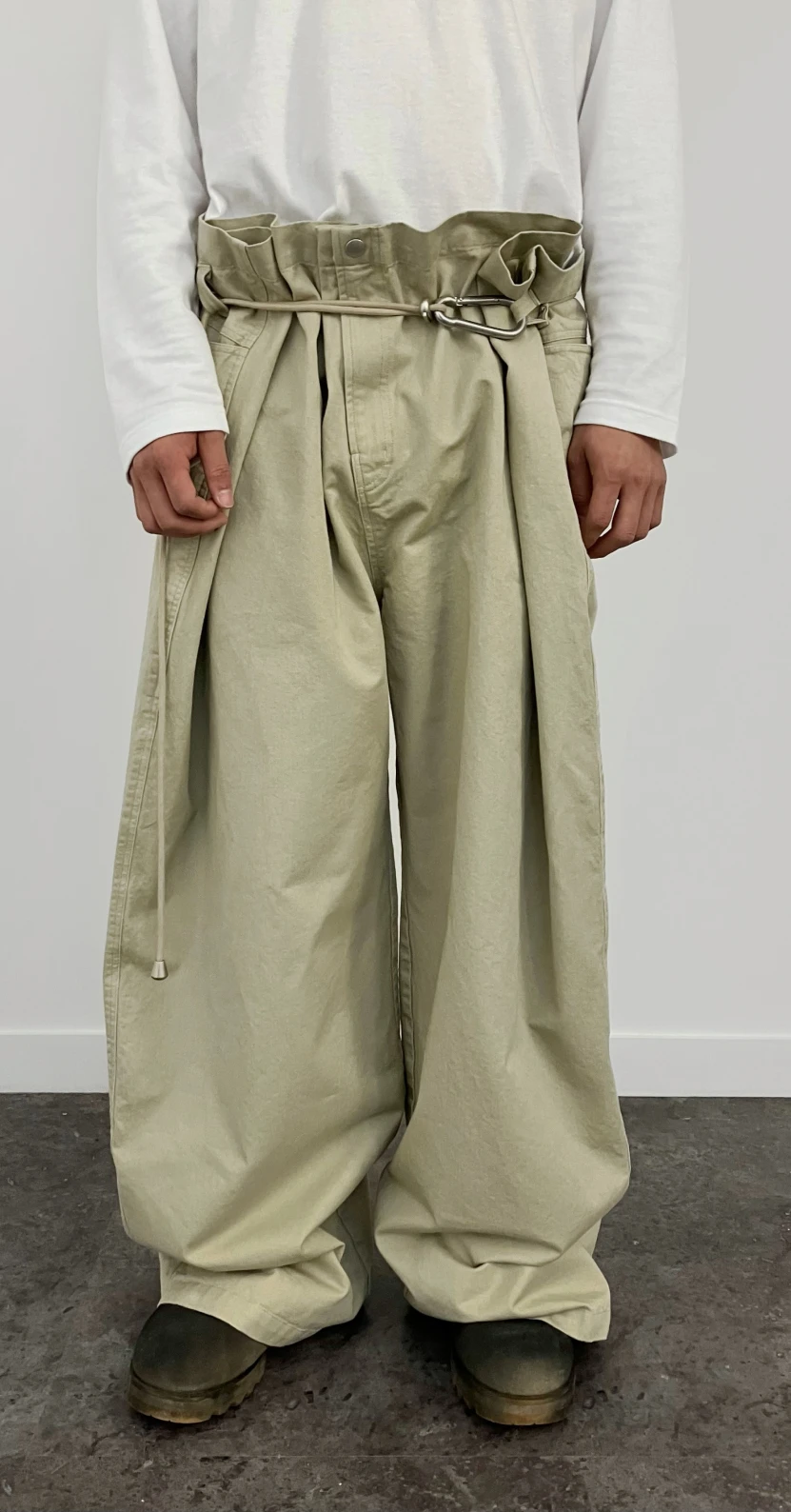 EGNARTS Adjustable Carabiner Pants, Beige—ultra-wide paperbag waist, adjustable rope belt with carabiner; styled with white long-sleeve and boots.