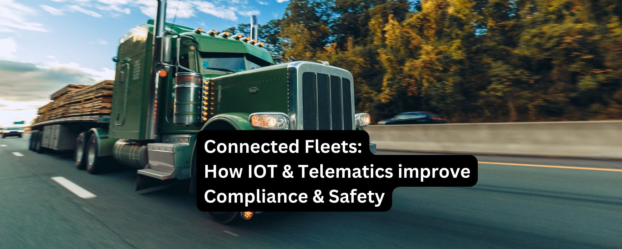 Green logging truck on a highway, representing IoT and telematics in connected fleets