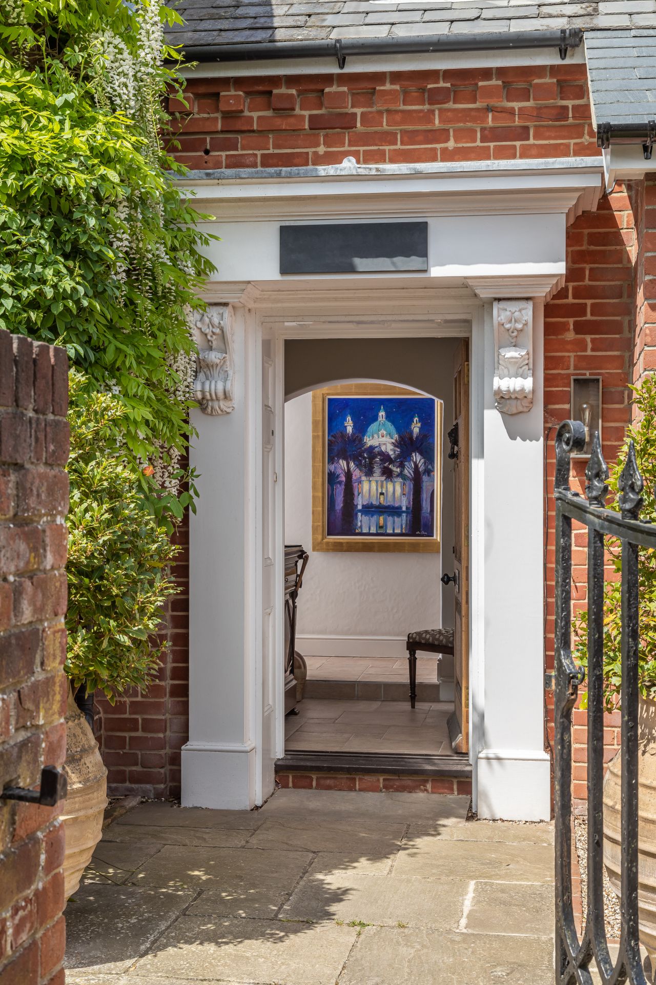 Looking into the door of a red brick house