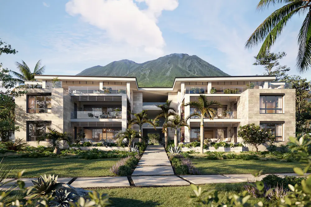 Four Seasons Nevis Peak Residences exterior, stone and timber facade framed by palm trees with Nevis Peak mountain behind