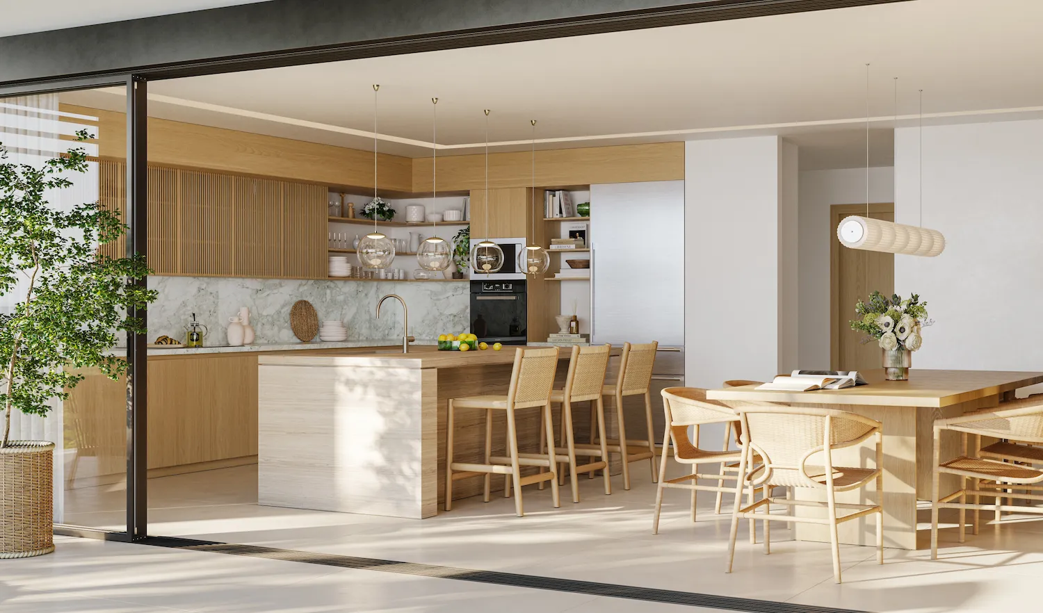 Open-plan kitchen and dining area with light oak cabinetry, marble backsplash and rattan seating opening onto a terrace at Four Seasons Nevis Peak Residences
