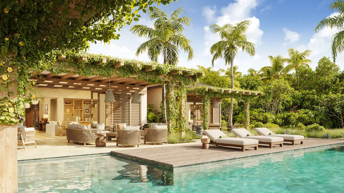 Vine-covered pergola terrace and pool overlooking tropical gardens at Nobu Residence, Barbuda