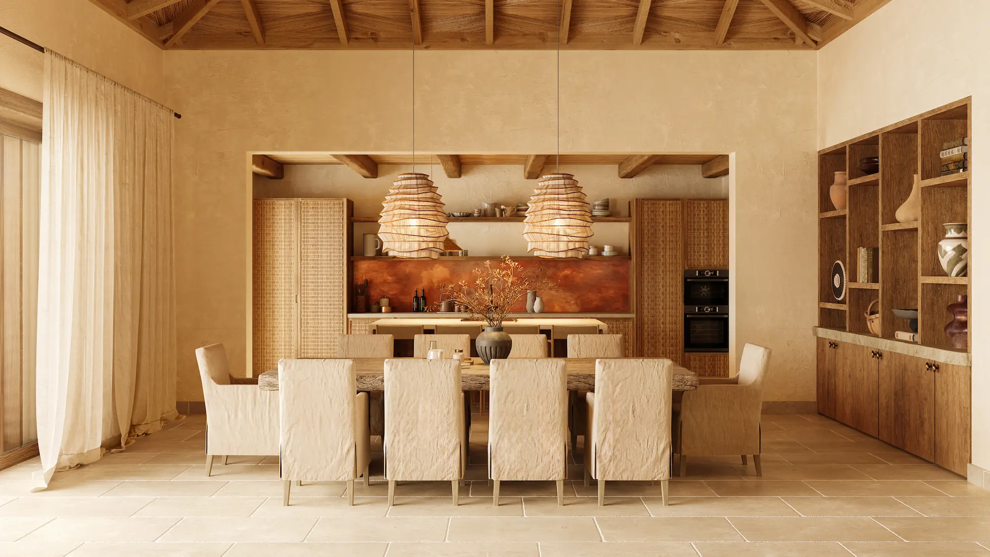 Long communal dining table beneath woven pendant lights, with a copper-toned kitchen backsplash at Nobu Residence, Barbuda