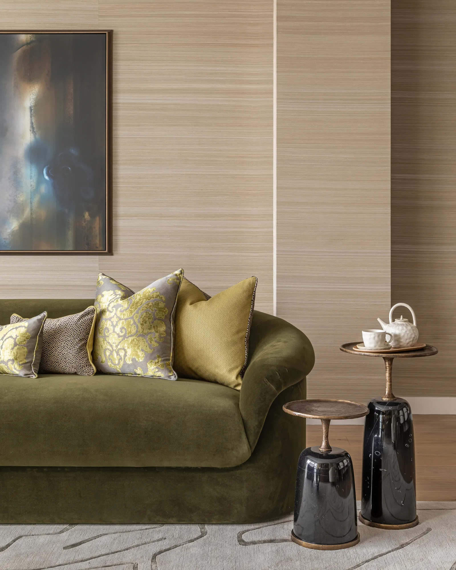 Inside of a living room with 3 couches around a table