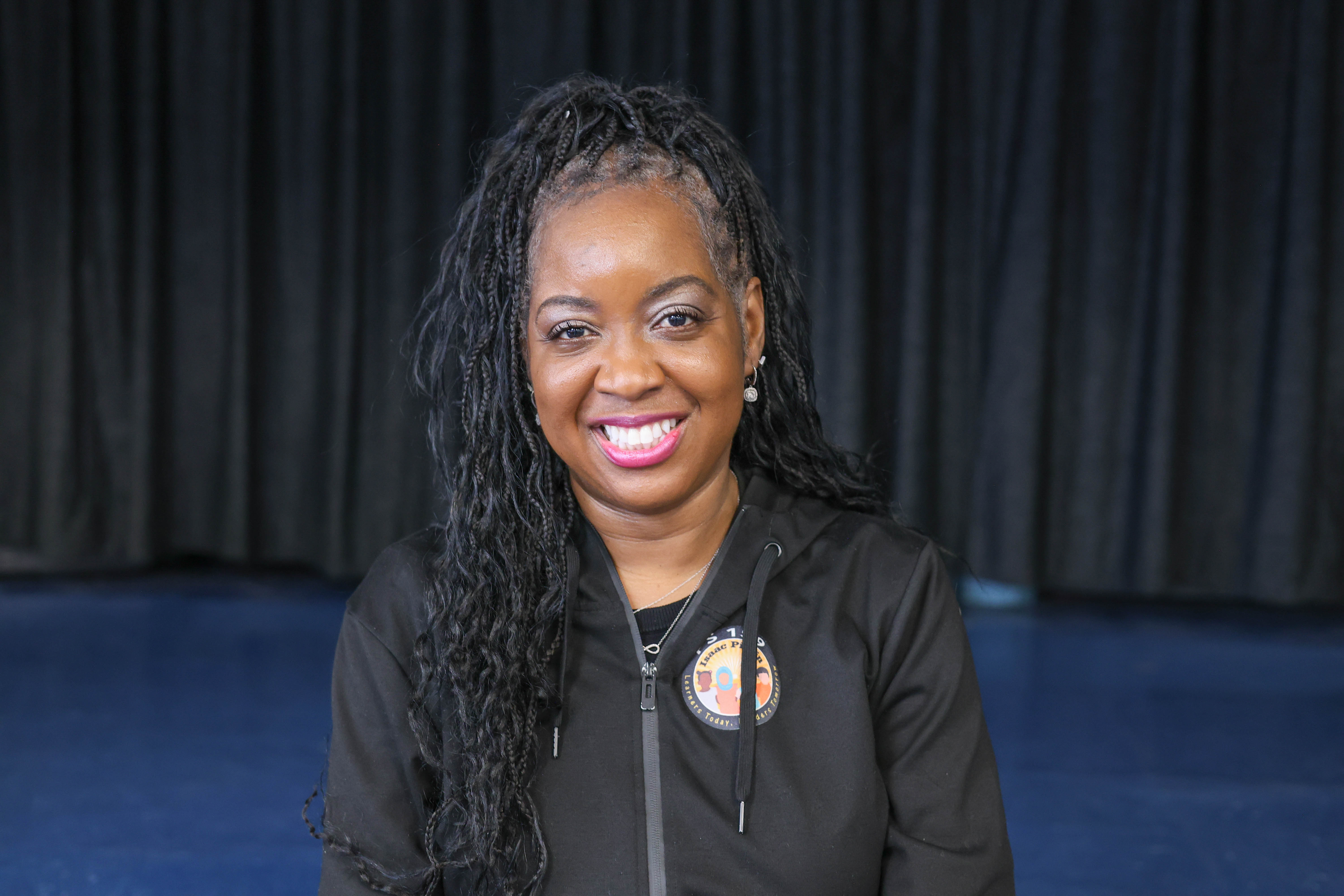 Patrice Thomas smiling in school staff portrait