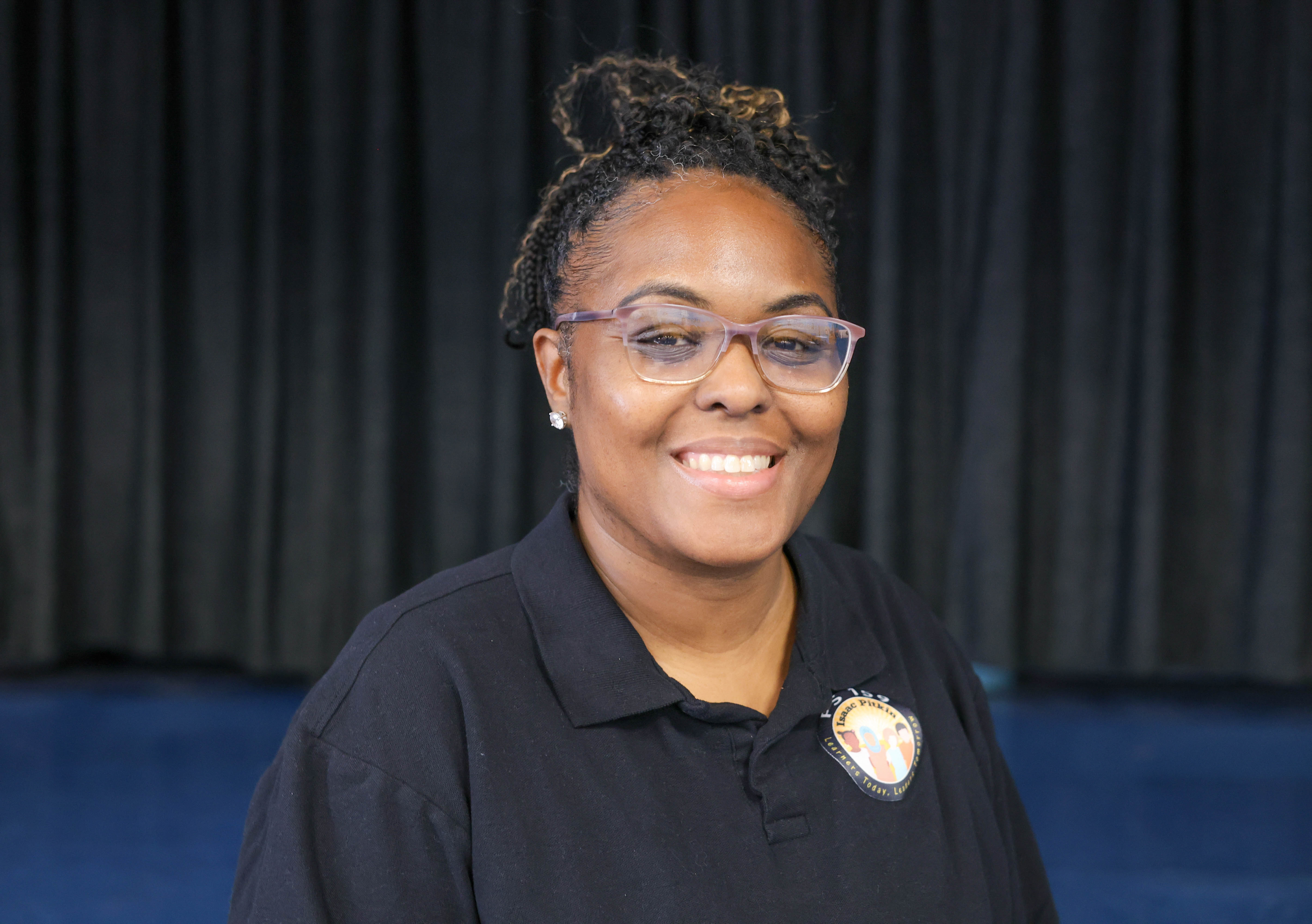 Francessa Alexis smiling in school staff portrait
