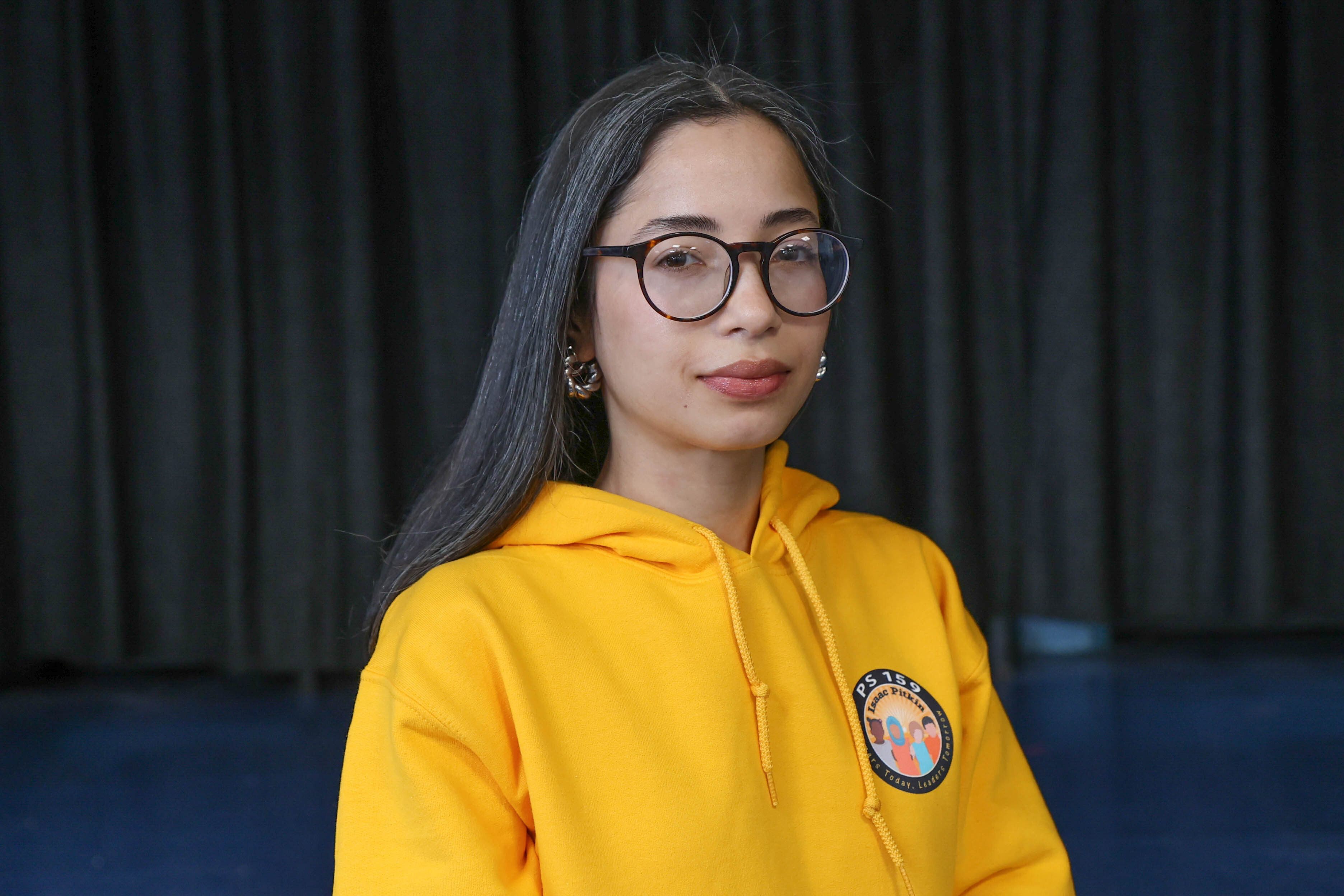 Yarmin Reyes wearing a PS 159 yellow school hoodie