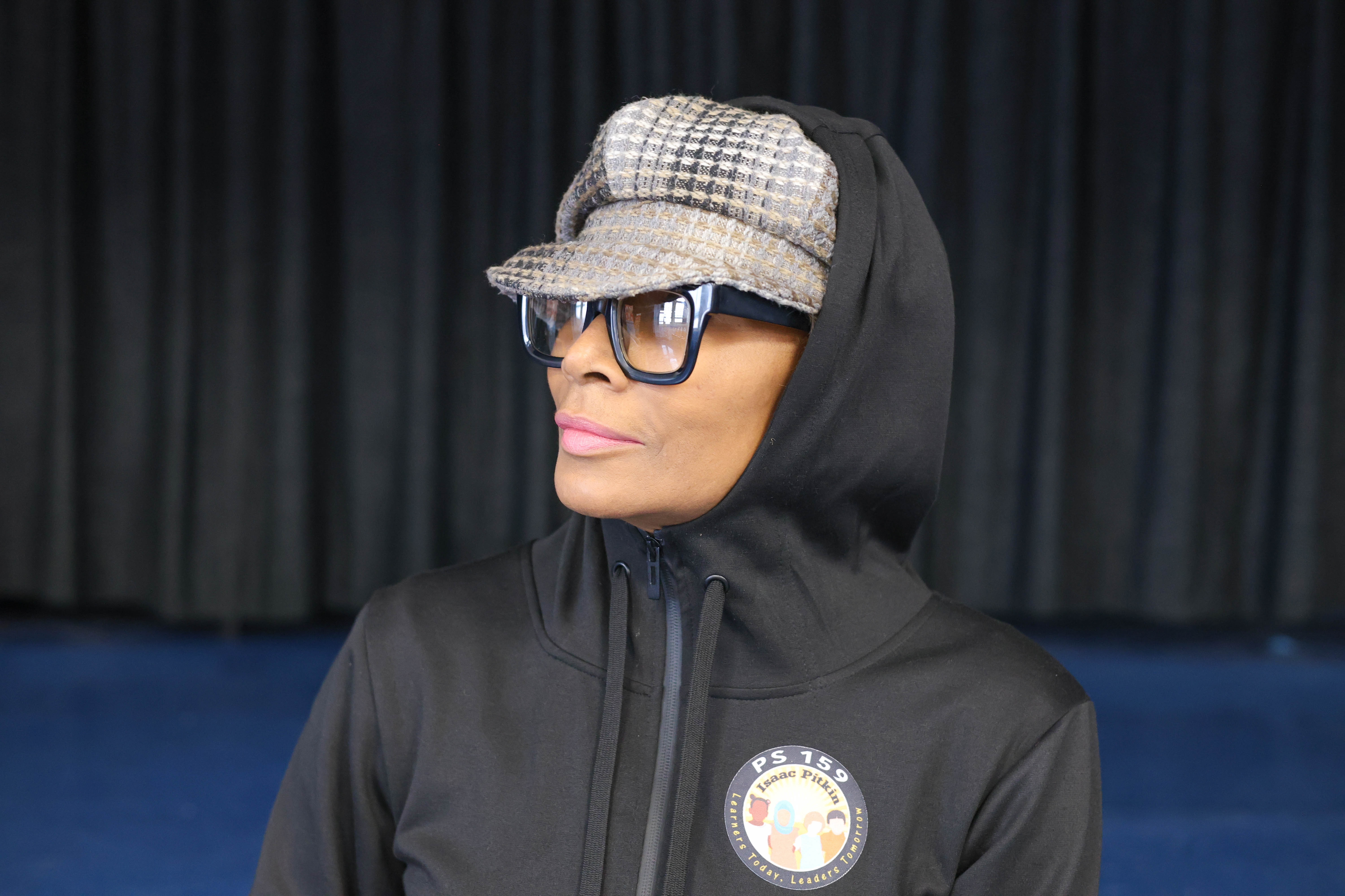 Staff member D. Lewis wearing PS 159 Isaac Pitkin school hoodie
