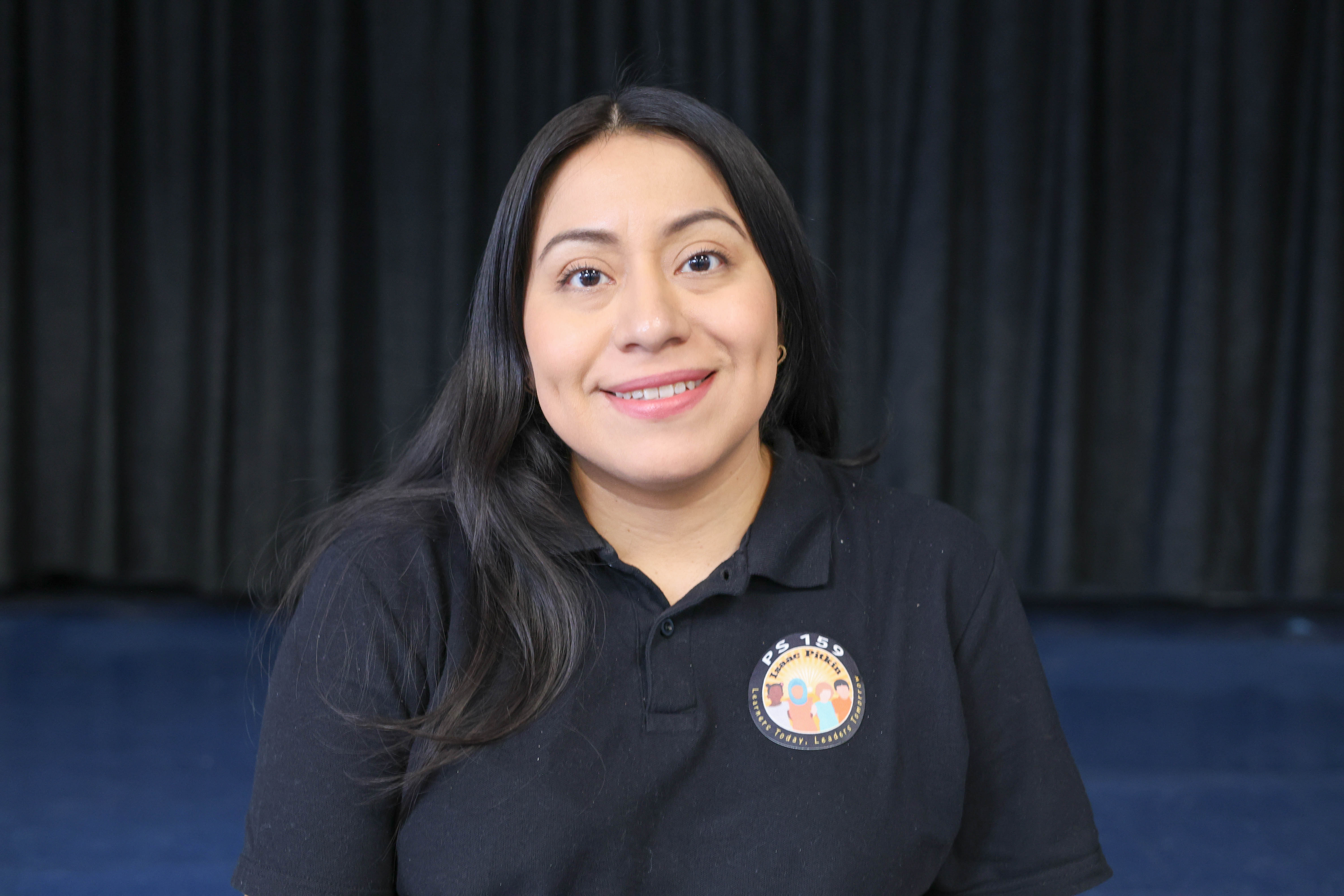 Yesenia Garcia smiling in PS 159 school uniform polo shirt