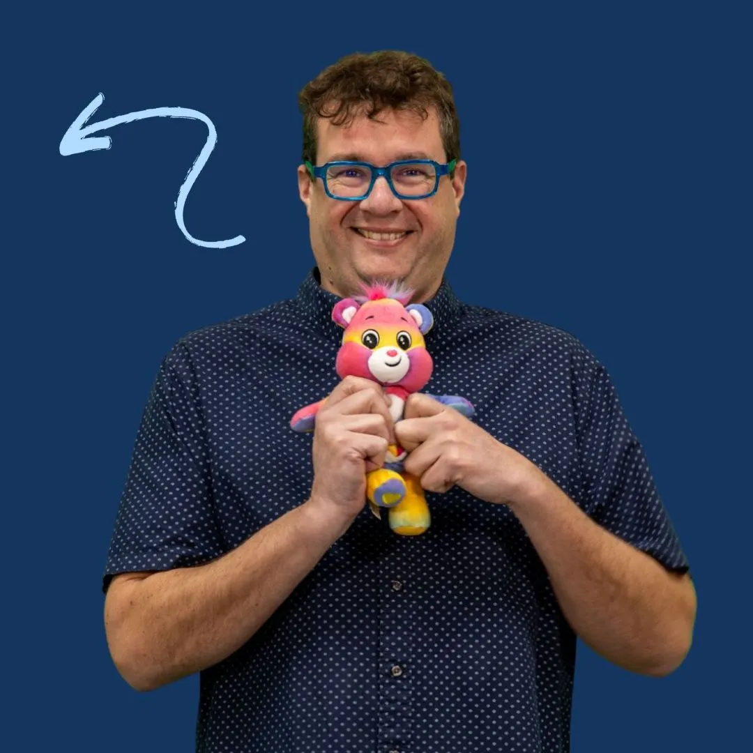 Photo of Lucent Director Steve Rowe holding a care bear