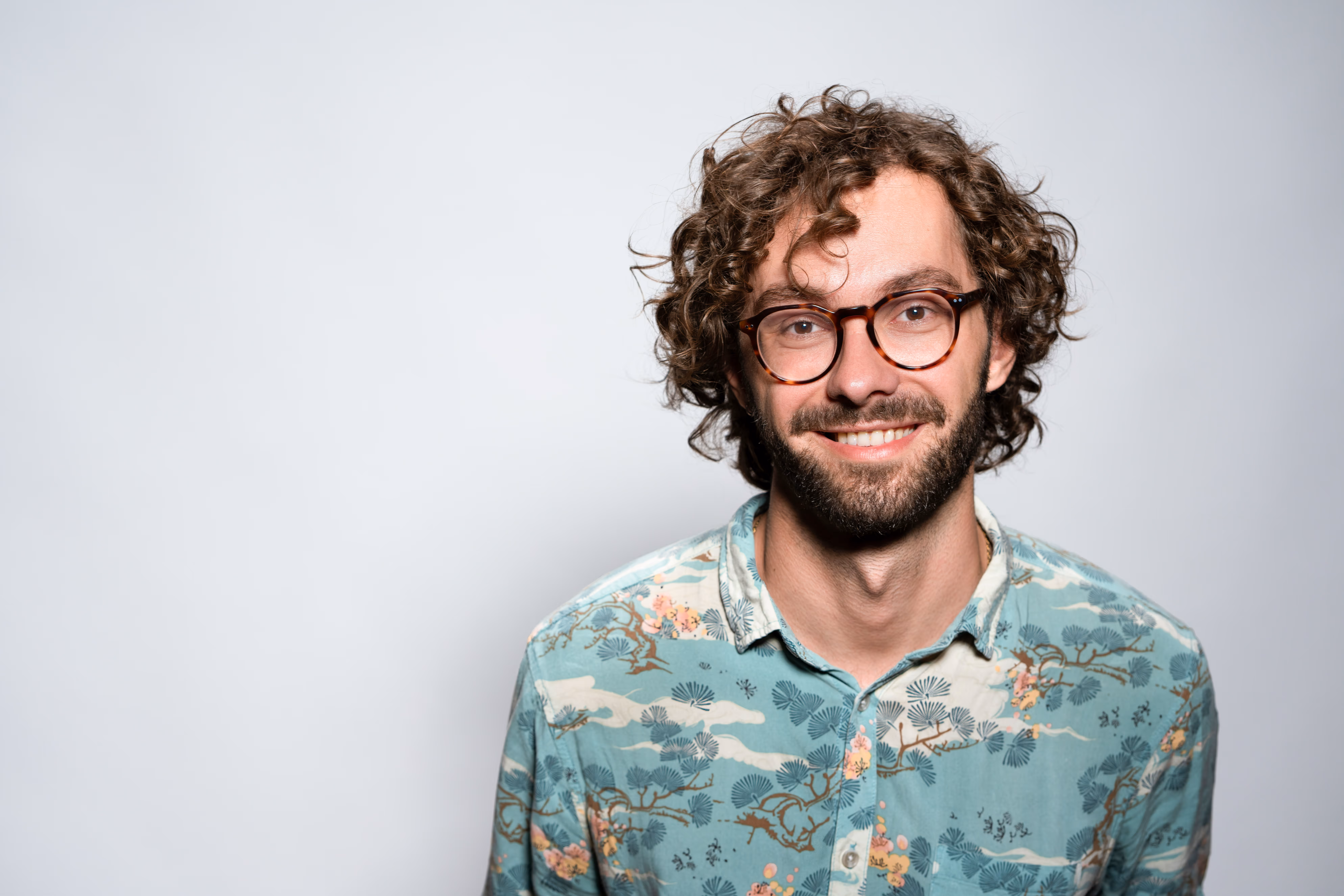 man with glasses headshot
