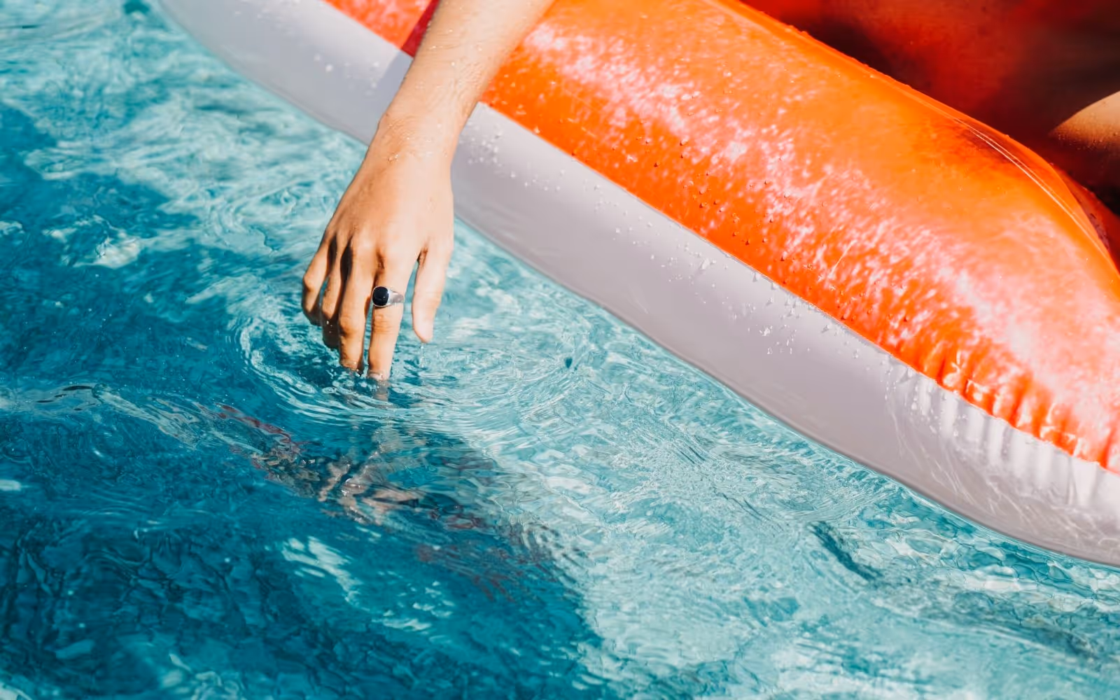 person floating on water float in pool