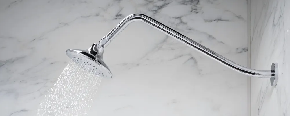A close-up of a gooseneck shower arm, showcasing its elegant curve and sturdy construction.
