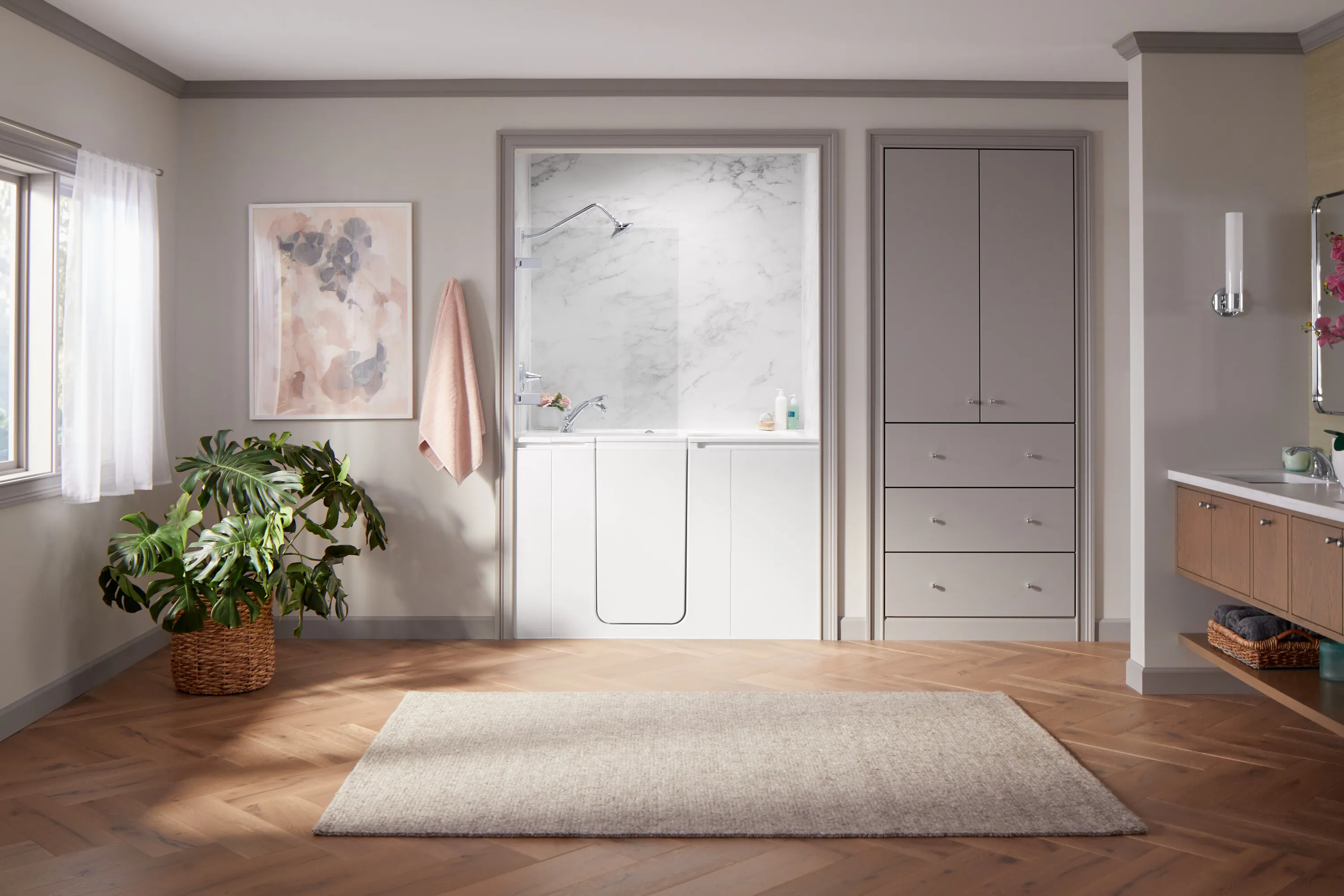 A newly remodeled bathroom with a sleek Kohler walk-in bath and stylish fixtures.